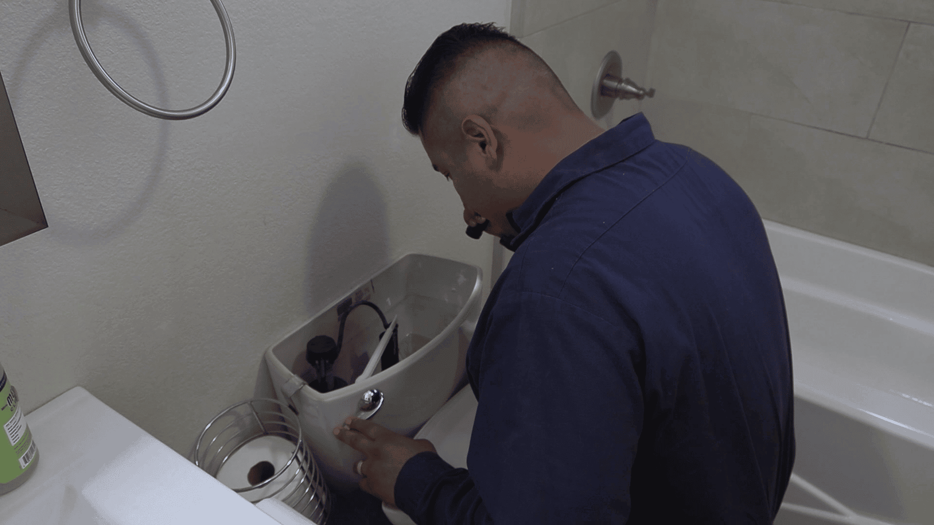 A technician inspecting a commercial plumbing system for any potential issues